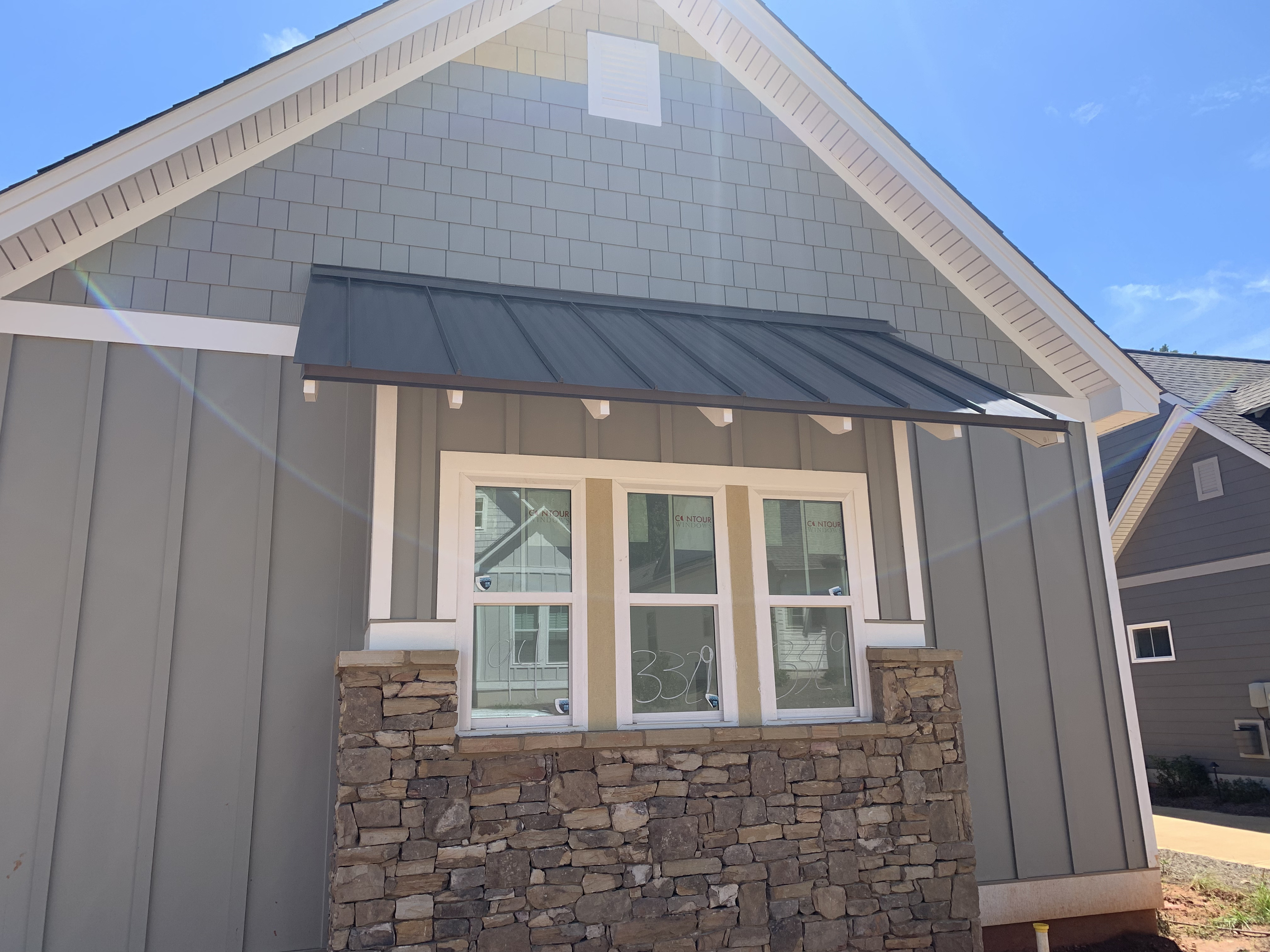 Standing seam metal shed roof with straight laps Grand National golf course village