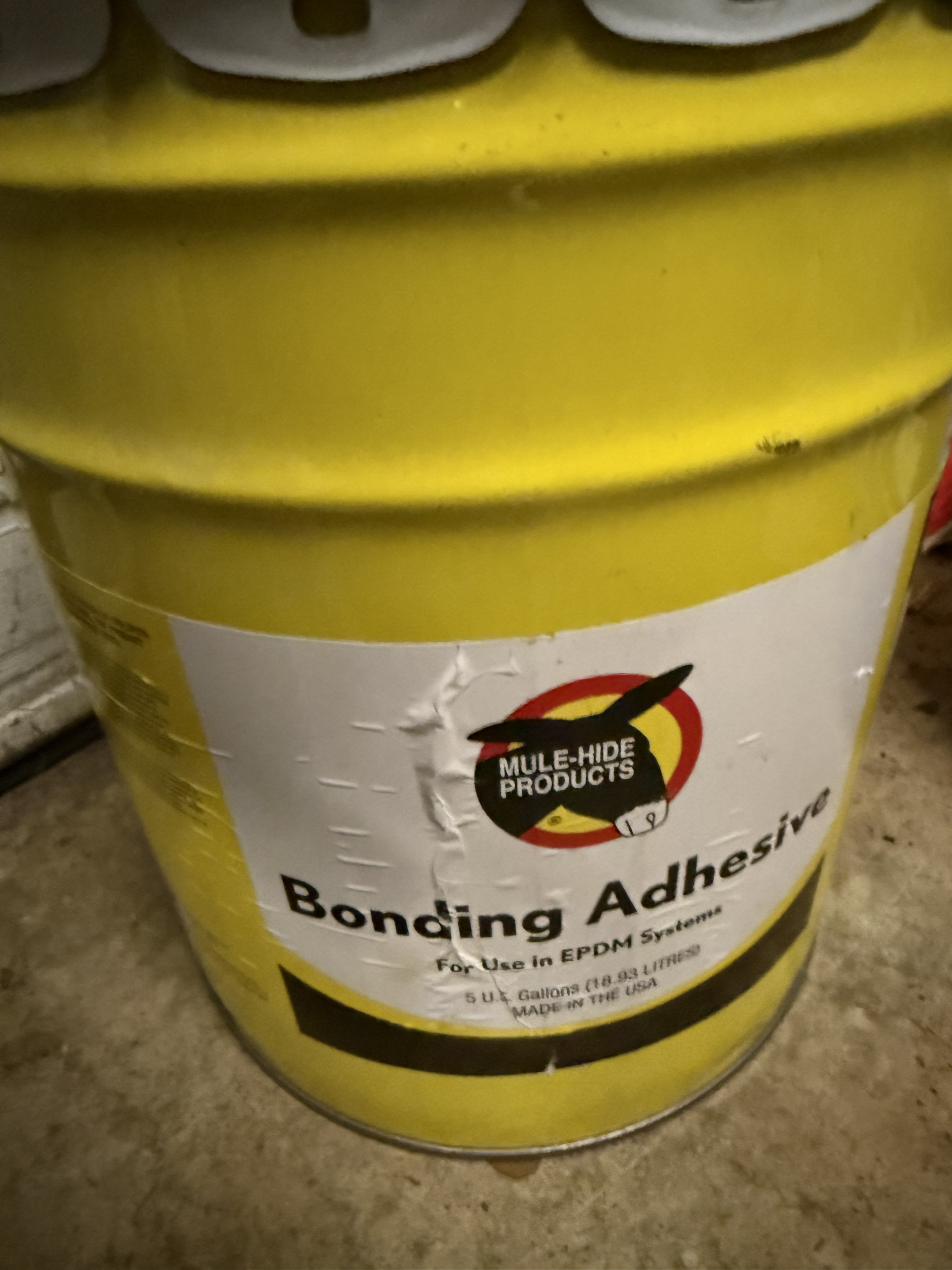 Can of Mule-Hide bonding adhesive