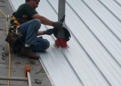 Worker Installs EPDM Boot and Decorative Shroud