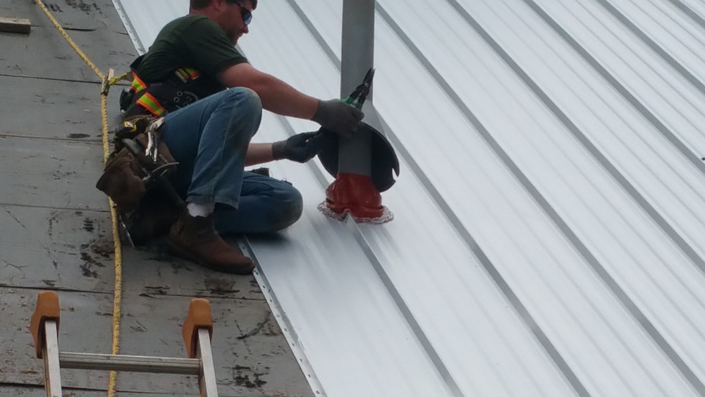 Worker Installs EPDM Boot and Decorative Shroud